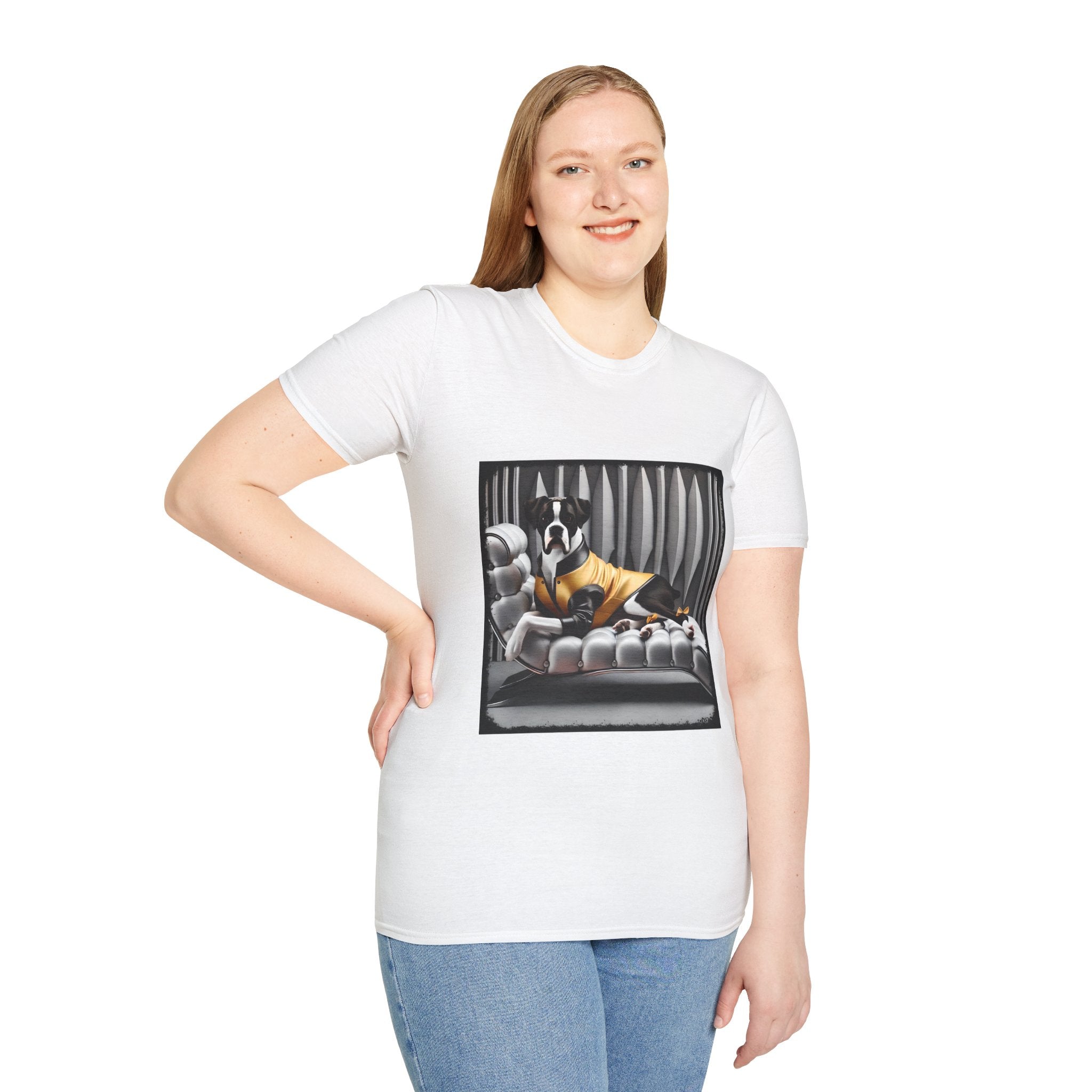Female model in white dog t-shirt featuring a black and white boxer lounging on silver tufted couch in yellow jacket with striped wall.