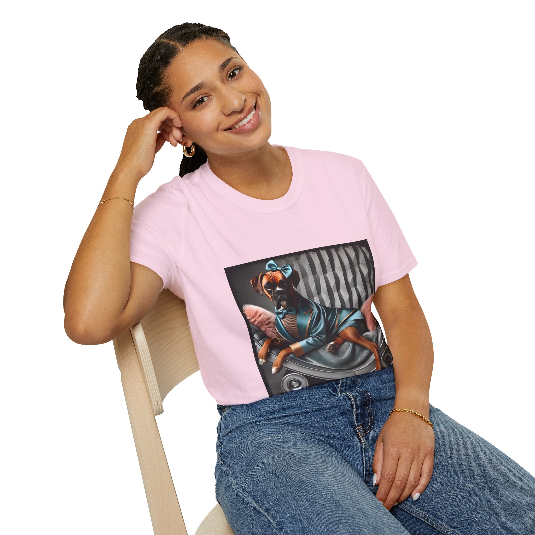 Female model in light pink dog t-shirt with a boxer in teal dress and bow on modern chair with striped wall and pink pillows.