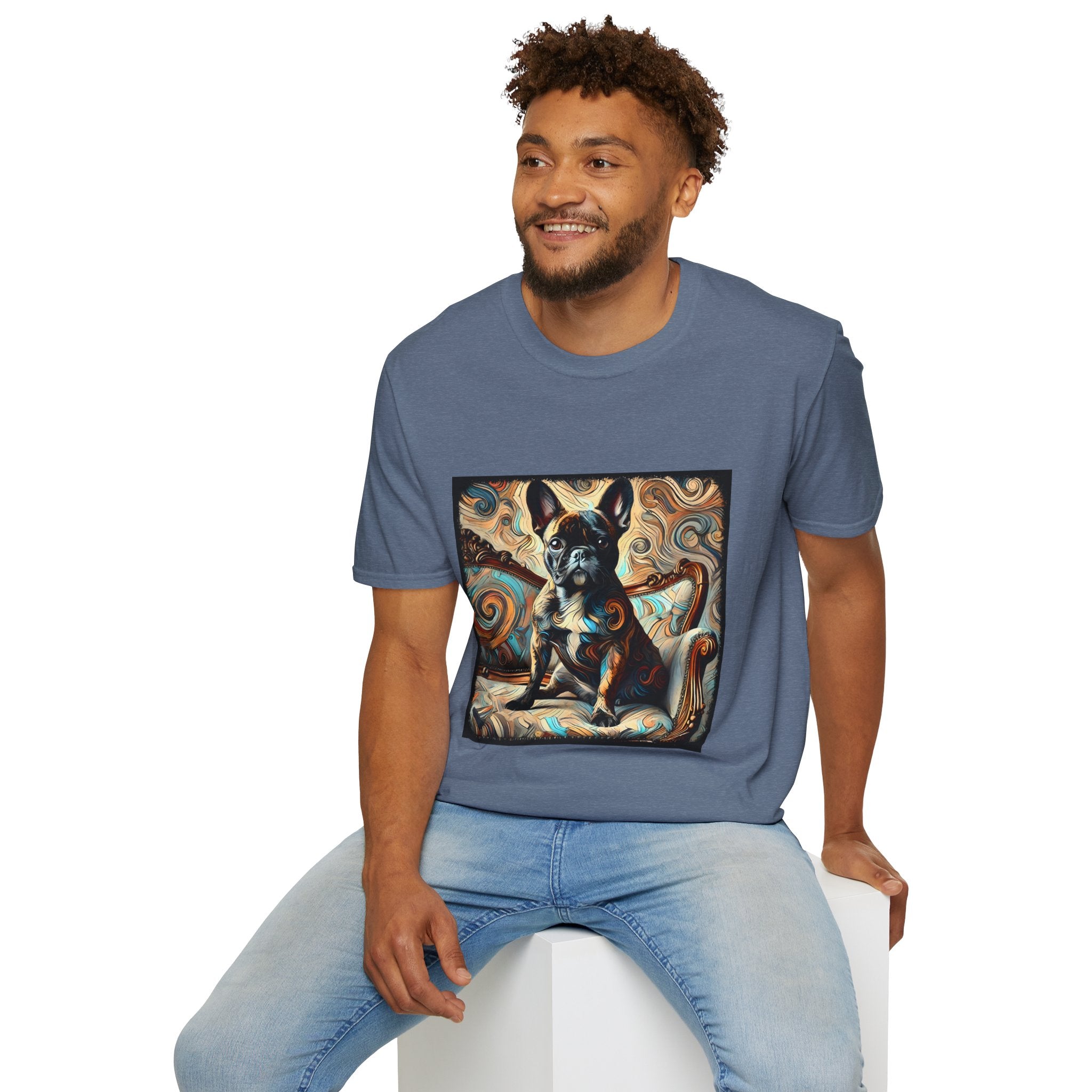 Male model wearing heather indigo dog t-shirt featuring black and tan French Bulldog on ornate settee with swirl pattern background.