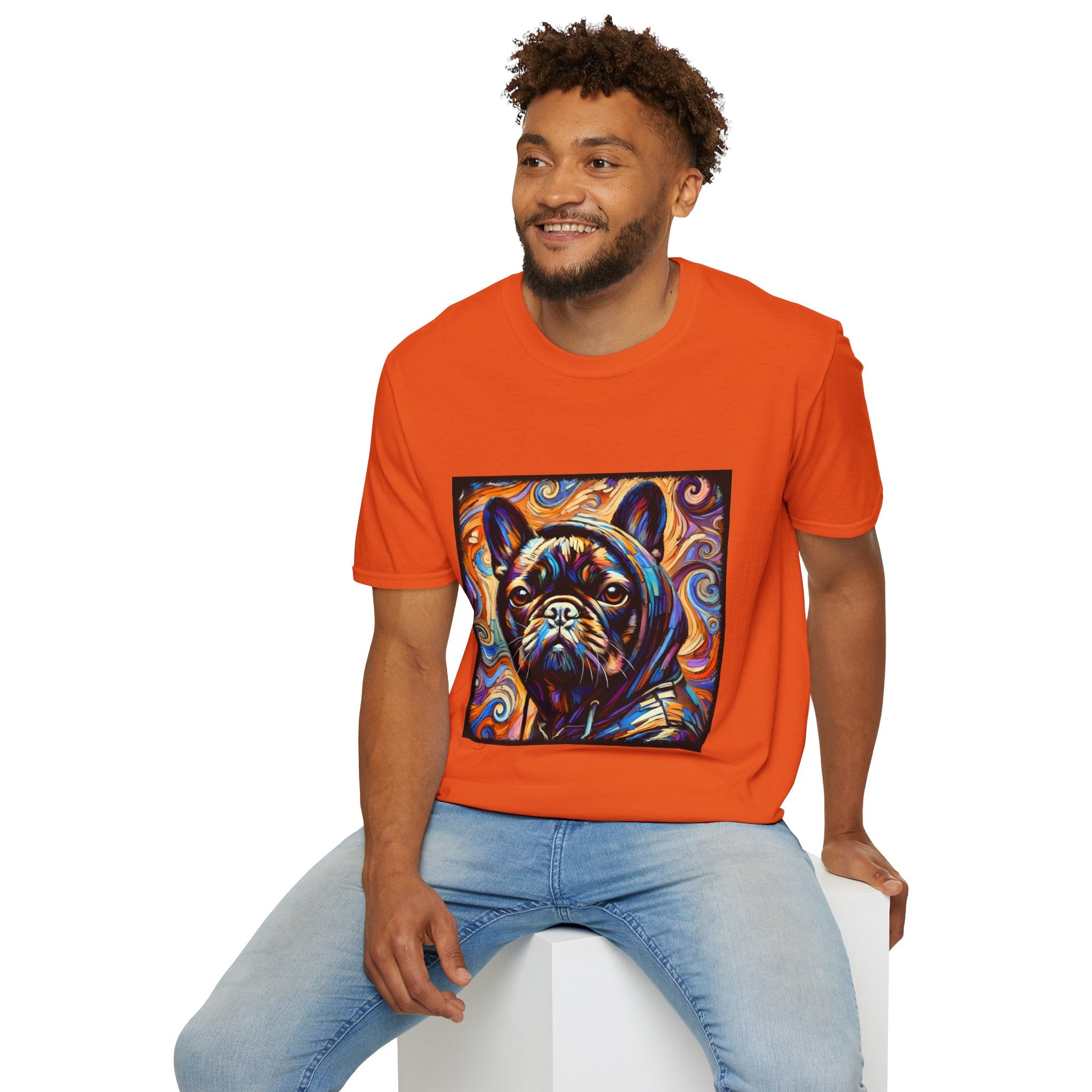 Male model in bright orange dog t-shirt featuring colorful French Bulldog in hoodie with vivid swirl background.