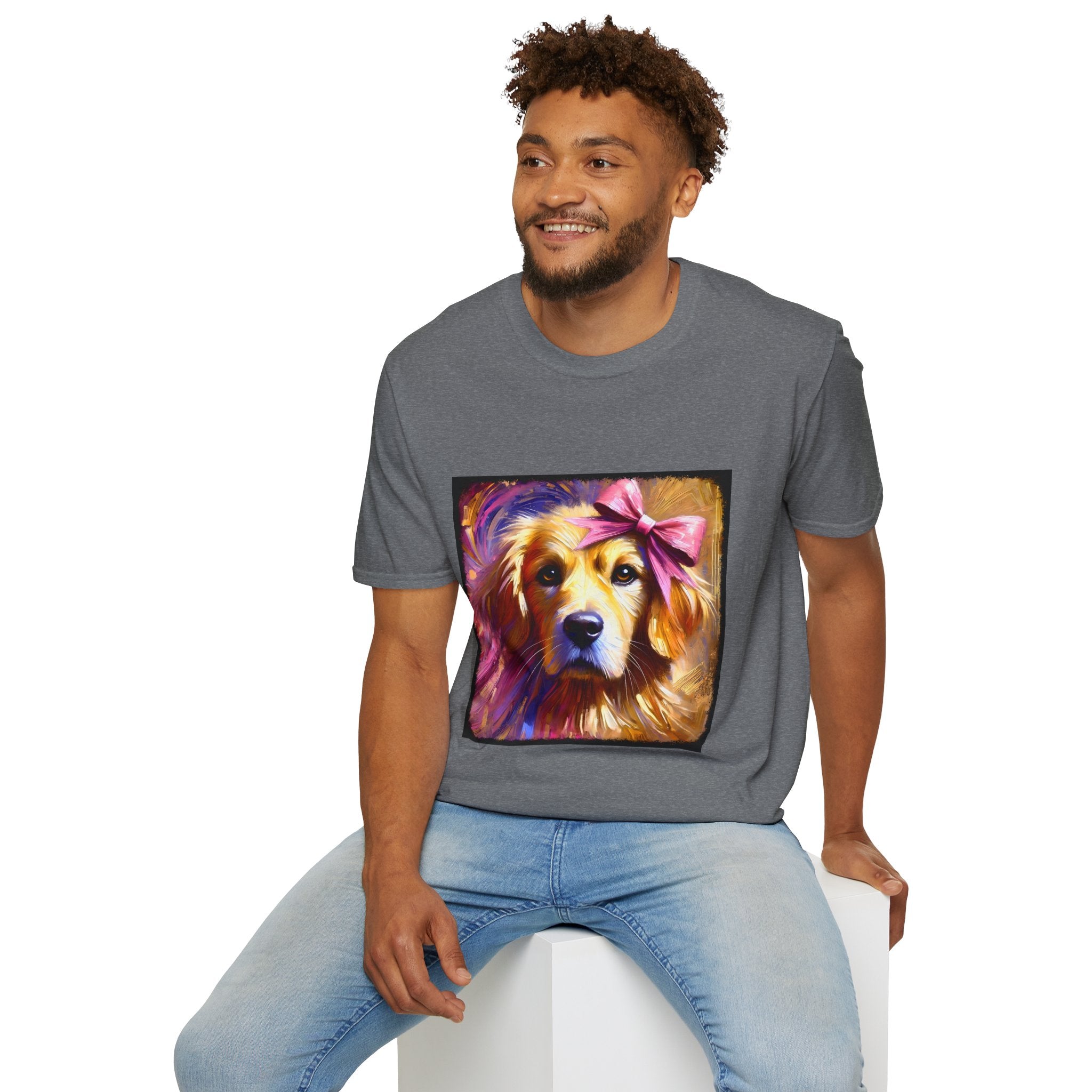 Male model in graphite heather dog t-shirt featuring golden retriever with pink bow on head, bold brushstroke background in pinks.