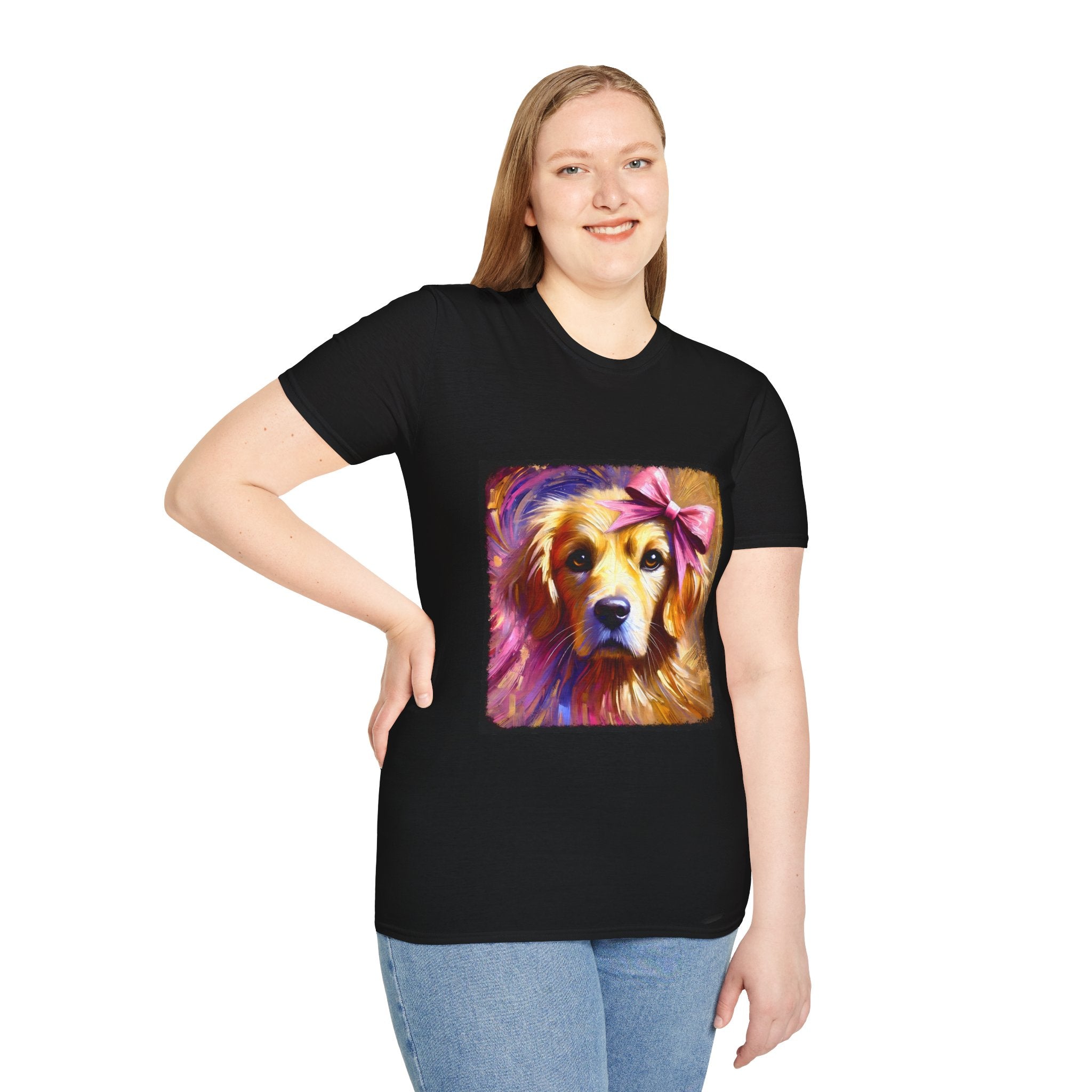 Female model in black dog t-shirt featuring golden retriever with pink bow on head, bold brushstroke background in pinks.