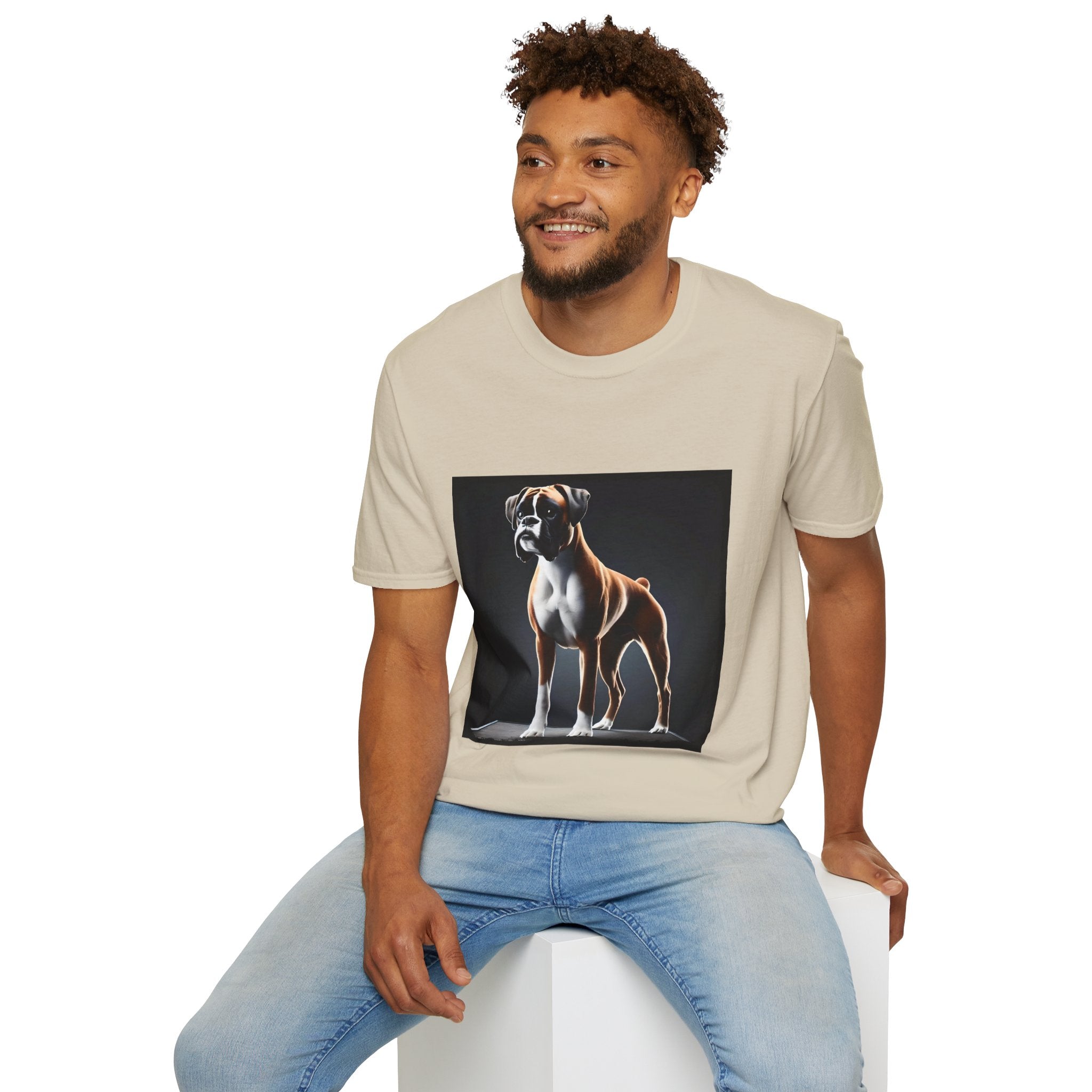 Male model in sand dog t-shirt featuring standing boxer on platform with black background and dramatic lighting.