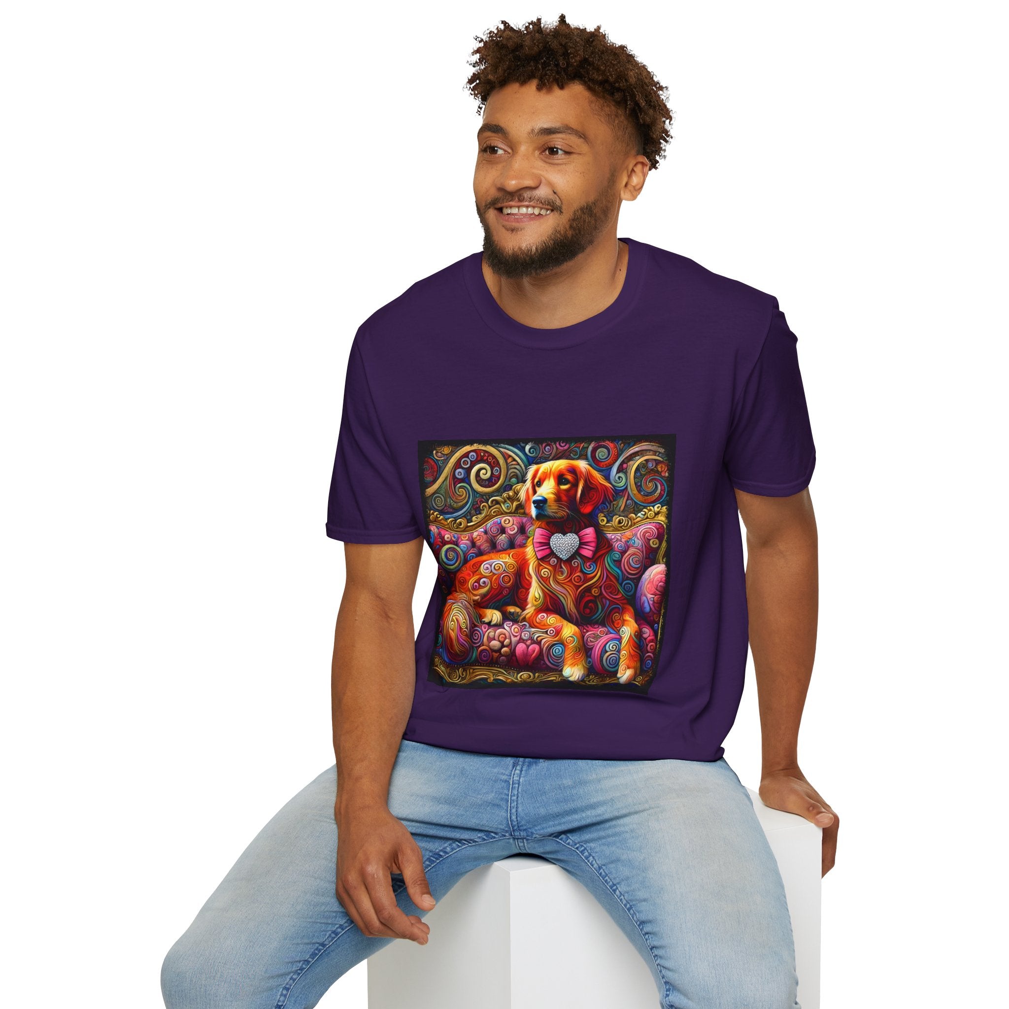 Male model in purple dog t-shirt with golden retriever in pink bow on vibrant swirl settee with heart details.