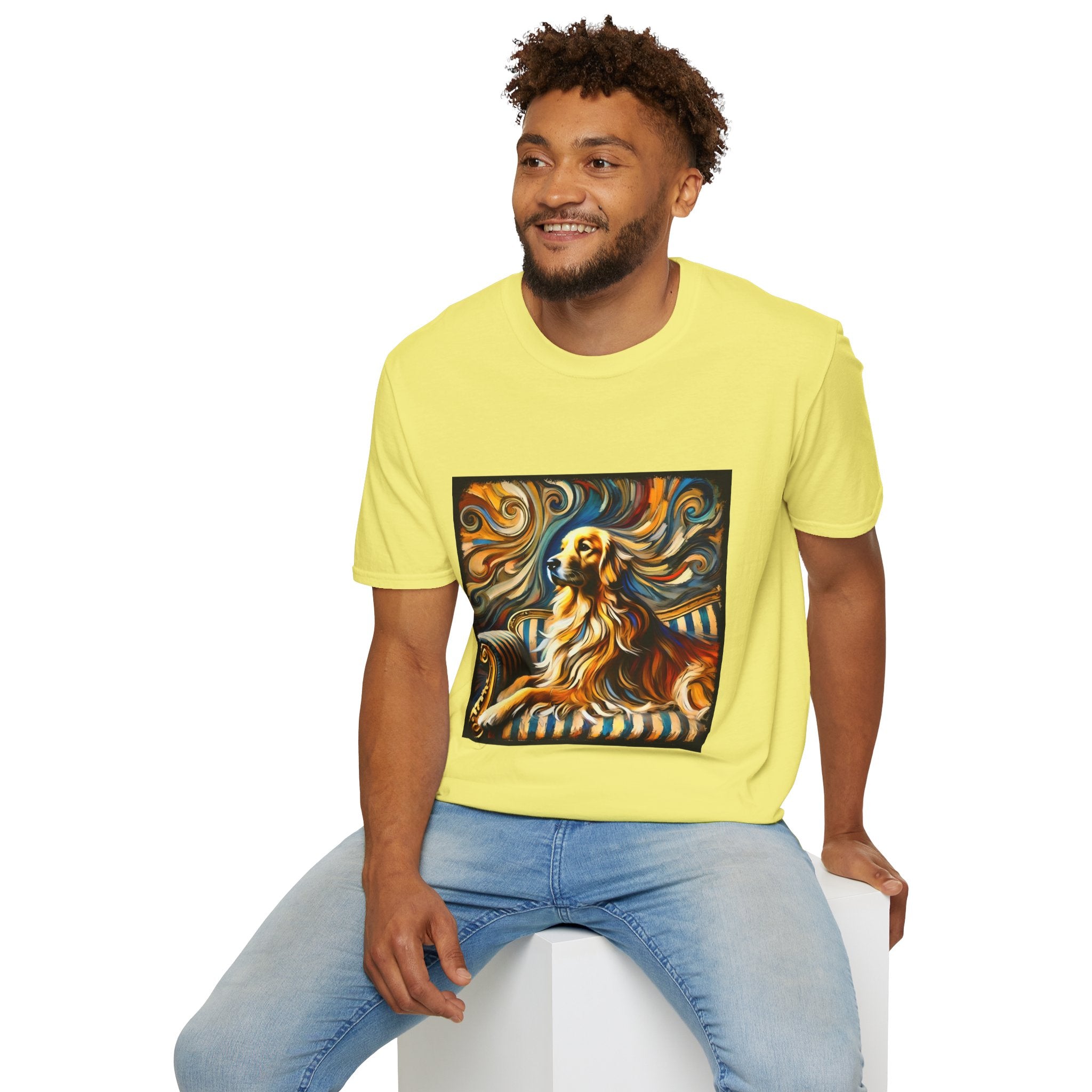 Male model in yellow dog t-shirt featuring golden retriever on striped settee with swirling abstract background in golds.