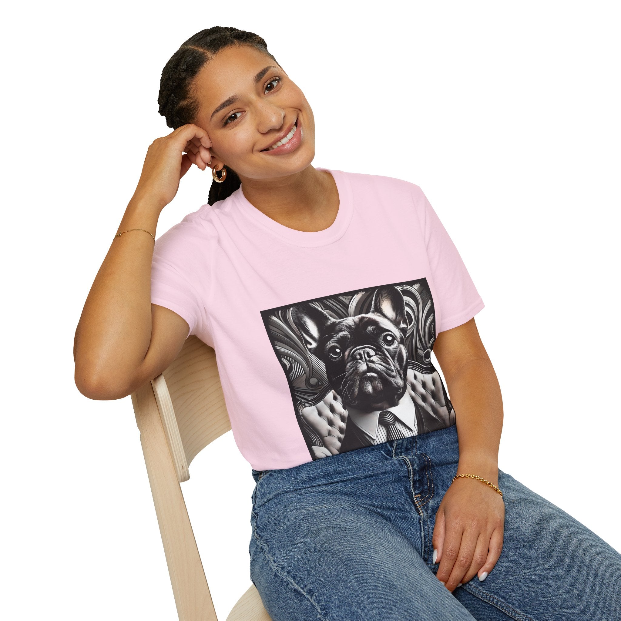 Woman sitting in light pink dog t-shirt featuring black French Bulldog in suit with monochrome swirl background.