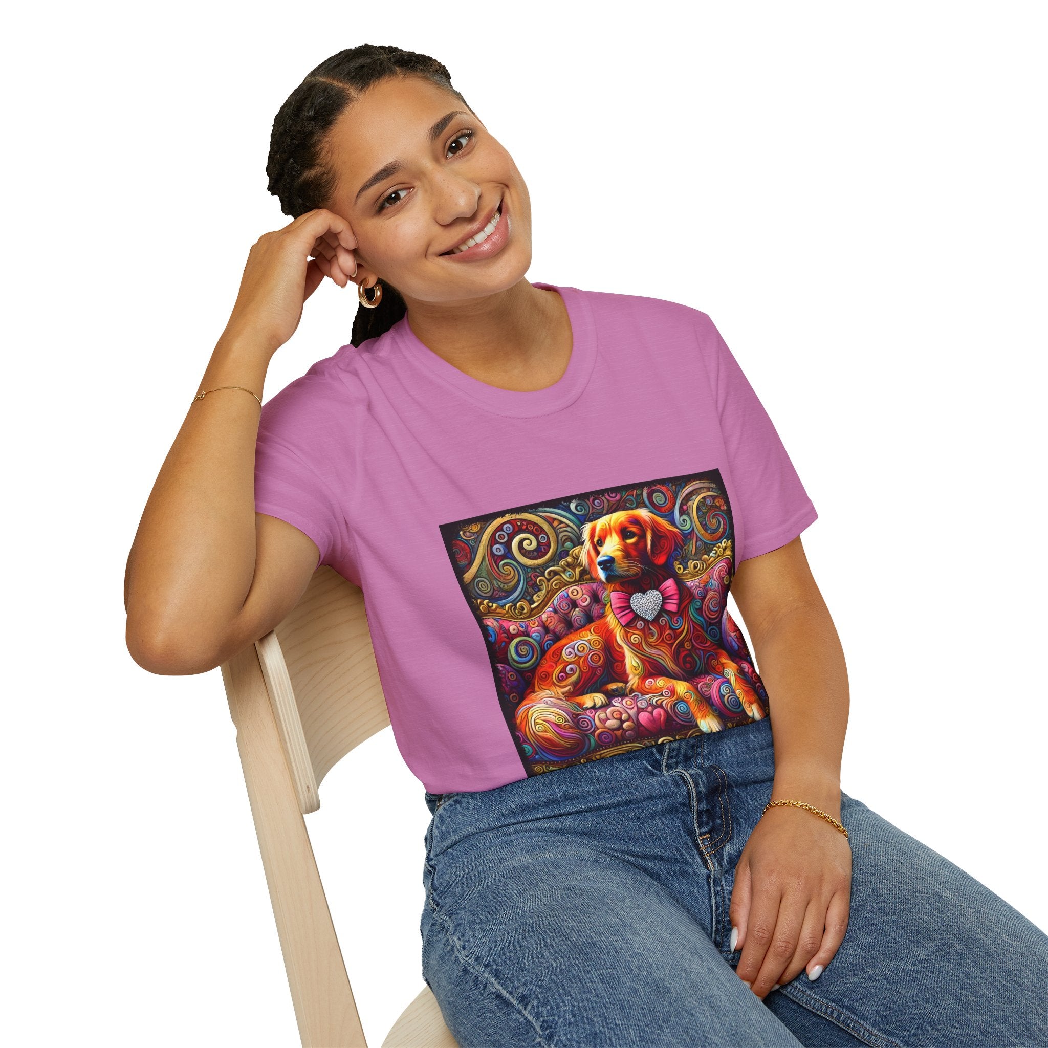 Woman sitting in pink orchid dog t-shirt with golden retriever in pink bow on vibrant swirl settee with heart details.