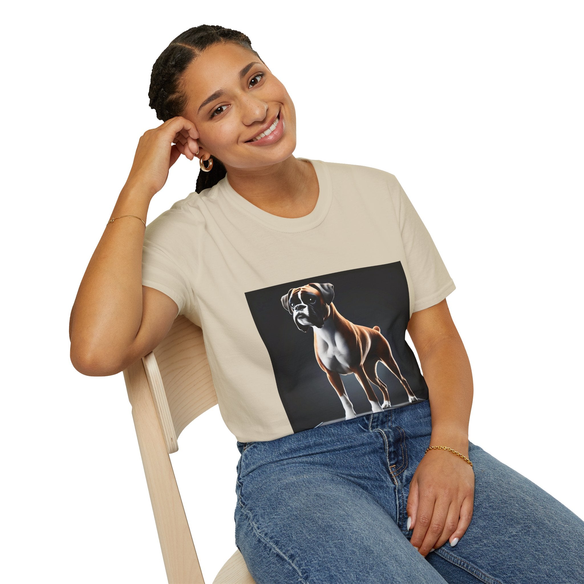 Female model in sand dog t-shirt featuring standing boxer on platform with black background and dramatic lighting.