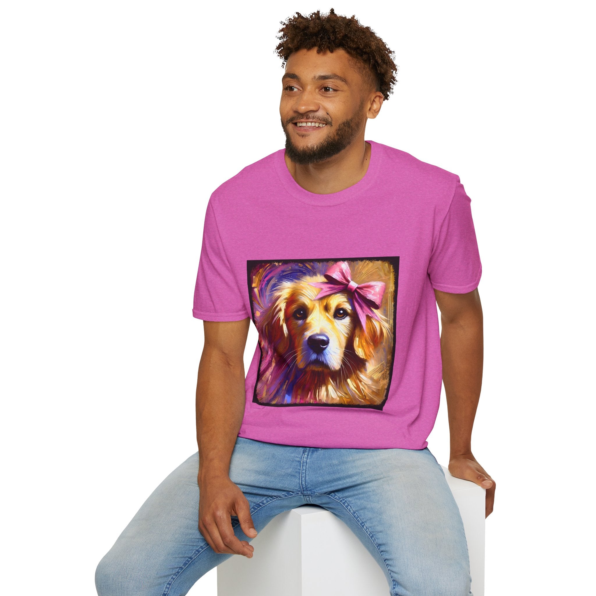 Male model in orchid pink dog t-shirt featuring golden retriever with pink bow on head, bold brushstroke background in pinks.
