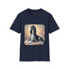 Front view of navy blue dog t-shirt featuring black and white Afghan Hound on cushion with diamond necklace, pastel background.