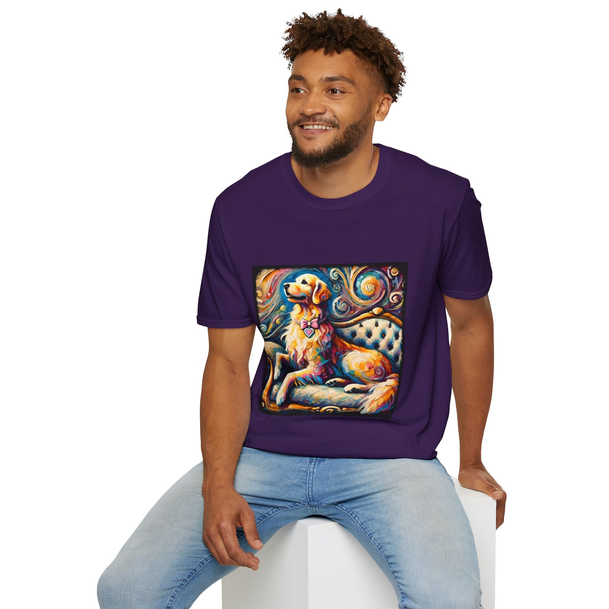 Male model in purple dog t-shirt featuring golden retriever with pink heart collar on colorful tufted settee.